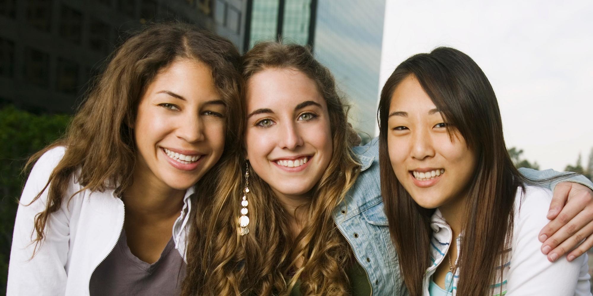 Diverce Teens by Street Narrow Photo